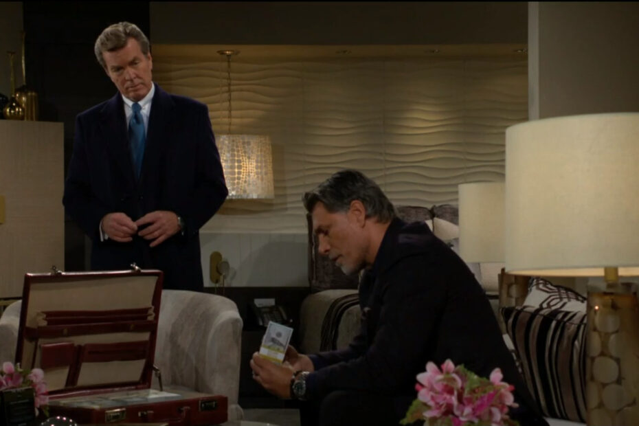 Jeremy Stark sits on the couch and looks through the money that Jack Abbott has brought him