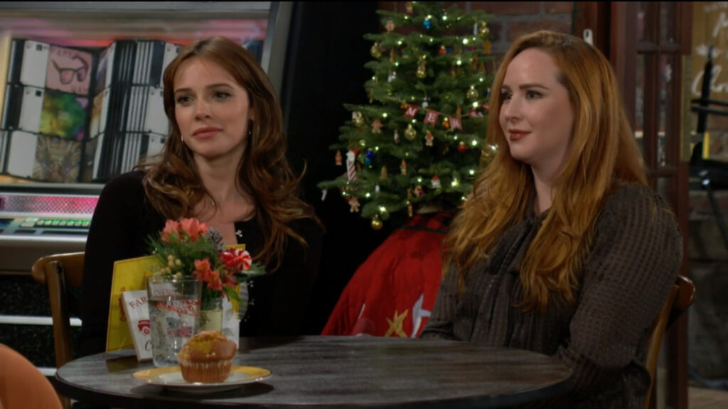Tessa and Mariah sit at a table with Sonja, who tells them about her life