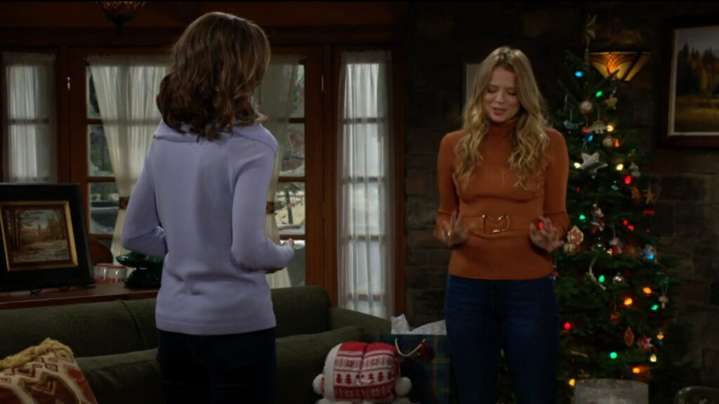 Summer and Diane talk in the cabin with a Christmas tree in the background