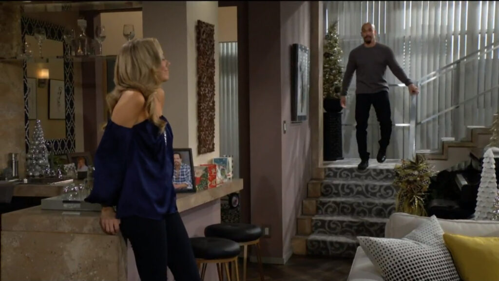 Abby is leaning on a counter as Devon comes down the stairs. She asks him if he'd do her a big favor.