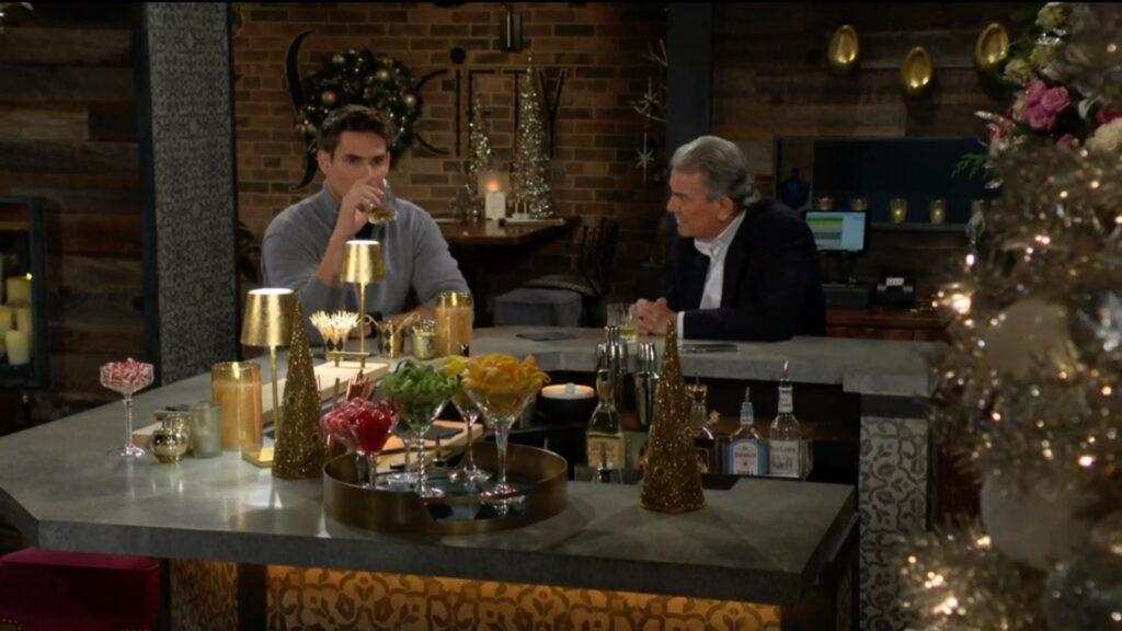 Adam looks troubled as he takes a drink of eggnog at the bar with his father, Victor Newman