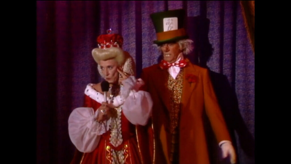 Catherine Chancellor and Rex Sterling are on stage, dressed up