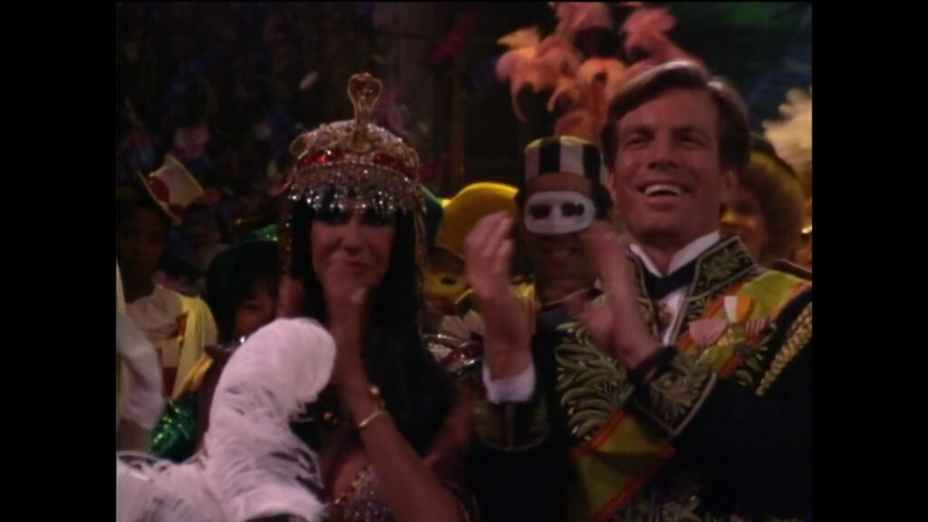Jill Abbott and Jack Abbott, dressed as Cleopatra and Prince Charming, applaud