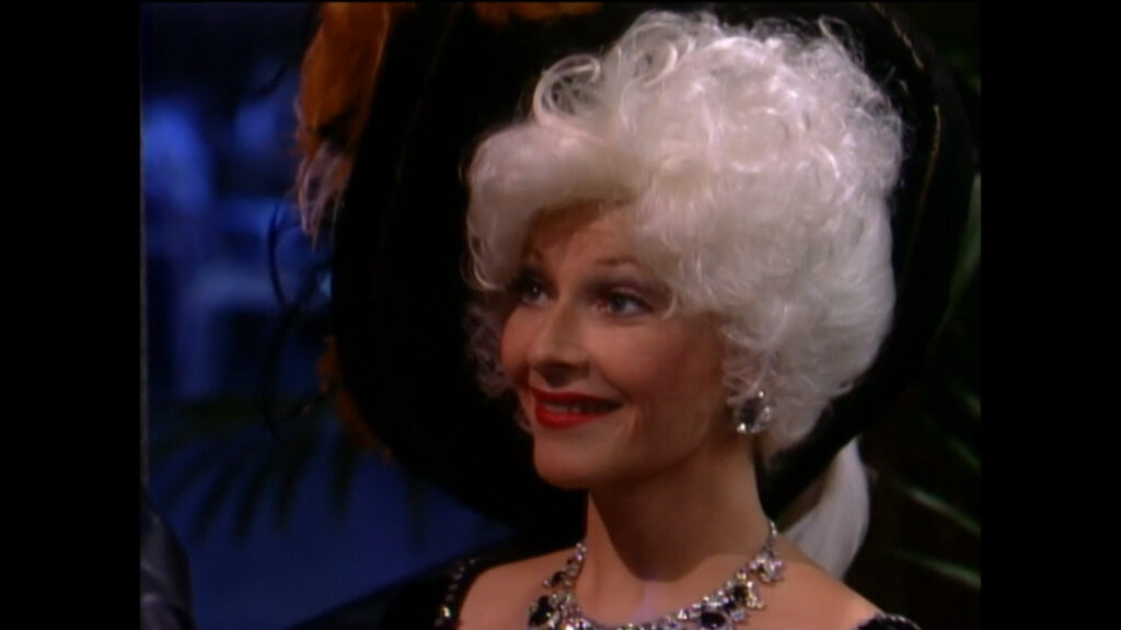 Traci Abbott as Mae West
