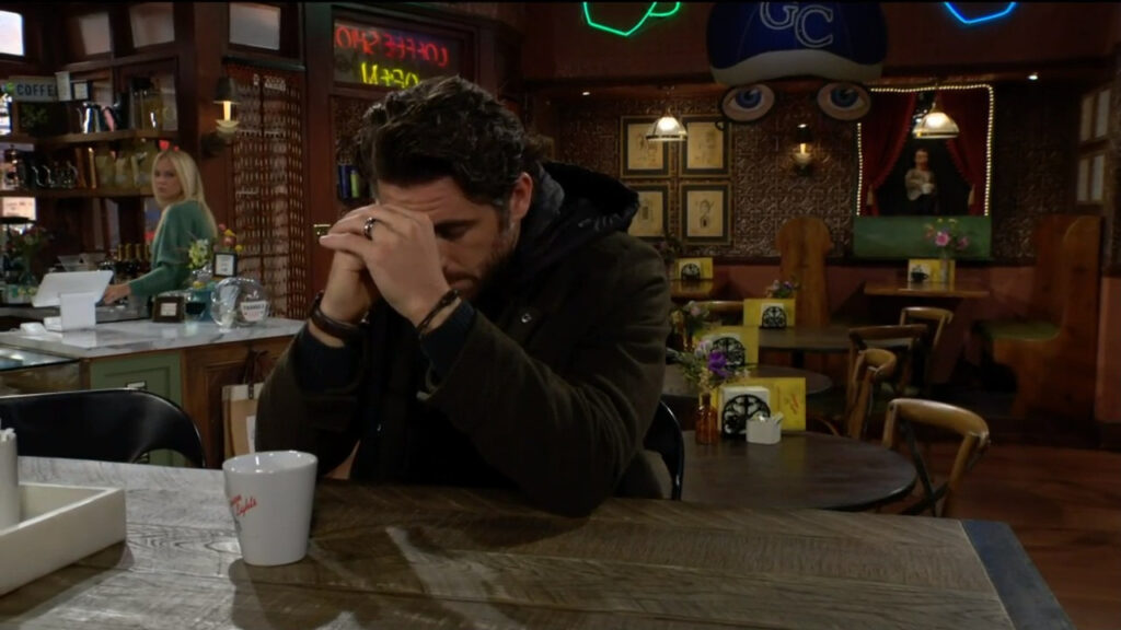Chance sits alone drinking a coffee at Crimson Lights - Young and Restless Recap for Dec 5, 2022