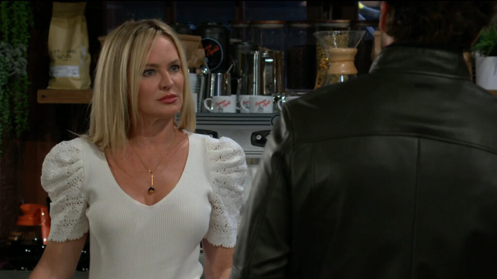 Sharon and Chance talk in the coffee shop