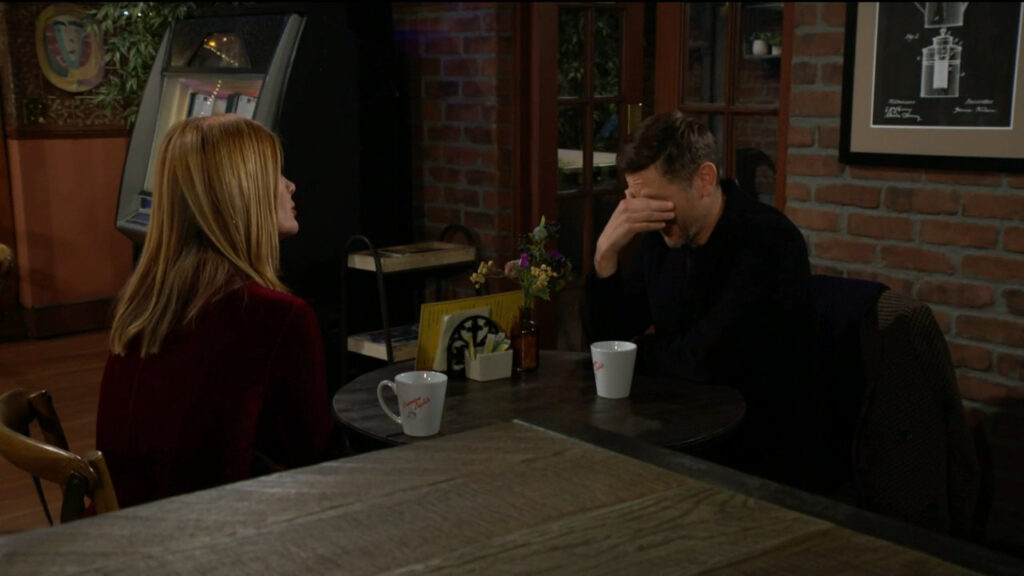 Daniel laughs and covers his eyes while talking to Phyllis