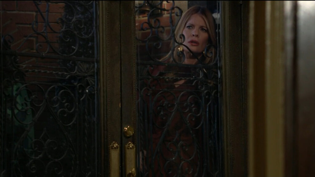 Phyllis watches through the glass door as Jack and Diane kiss inside the house