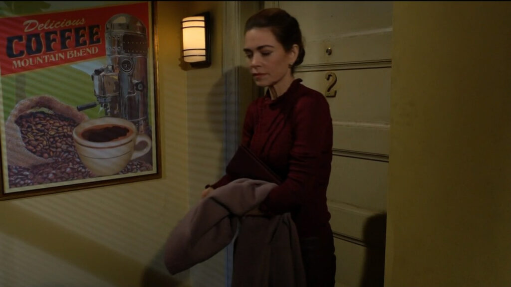 Victoria listens to the banter from inside Chelsea's as she puts on her coat outside the door