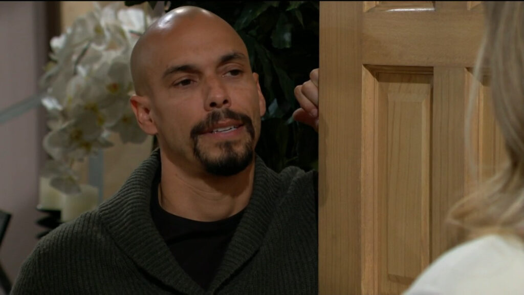 Devon looks pensive as he answers the door for Abby