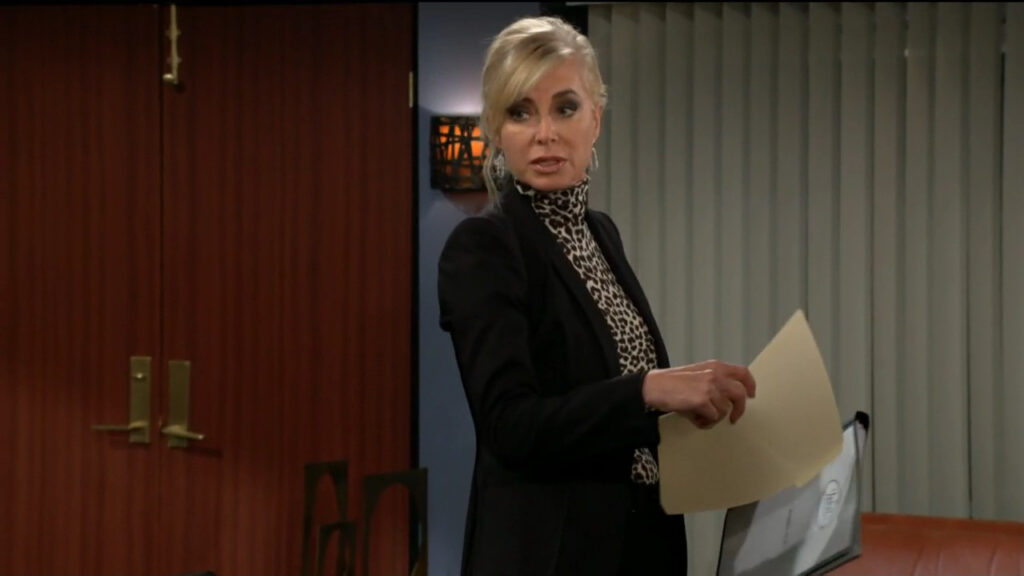Ashley holds some files as she talks to Jack in his office at Jabot