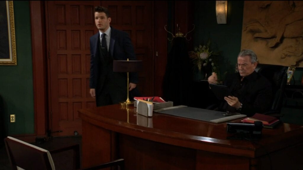 Kyle comes into the office at Newman Enterprises and talks to Victor