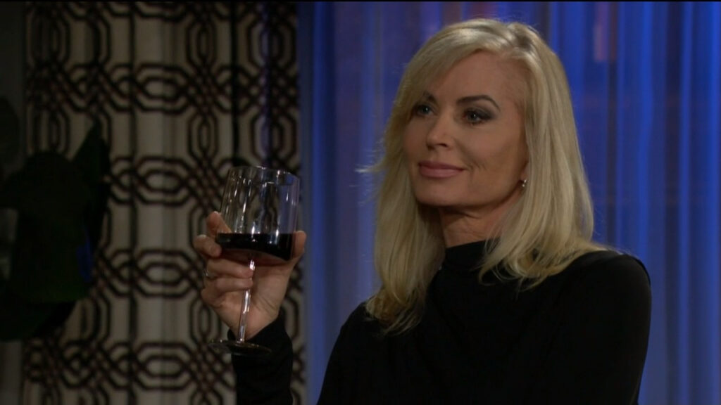 Ashley holds a glass of wine and speaks with Tucker