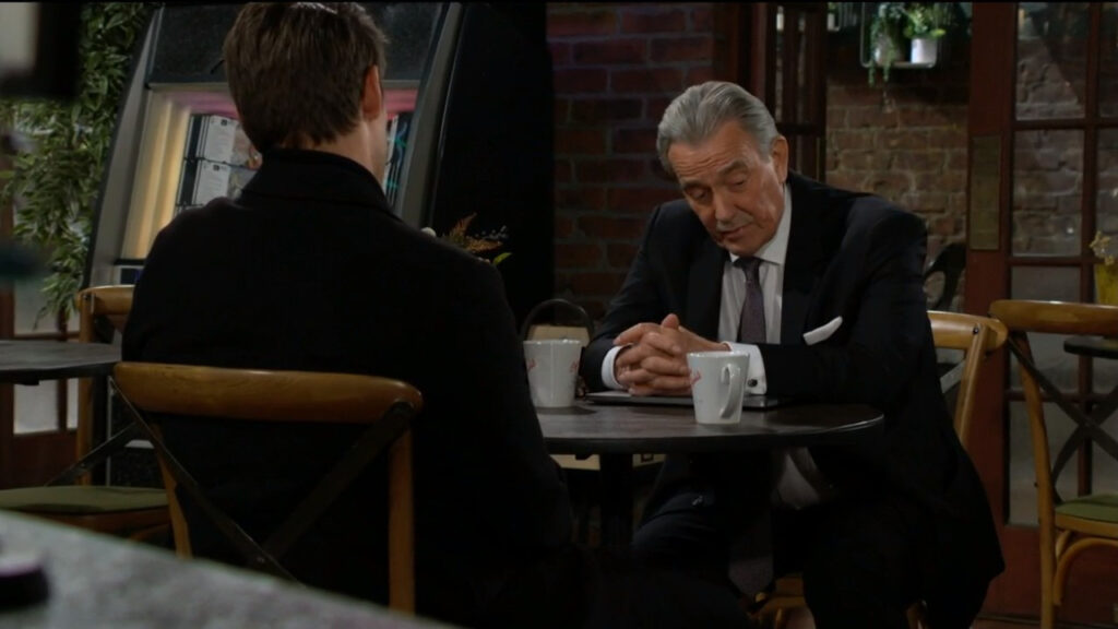 Victor and Adam talk in the coffee shop