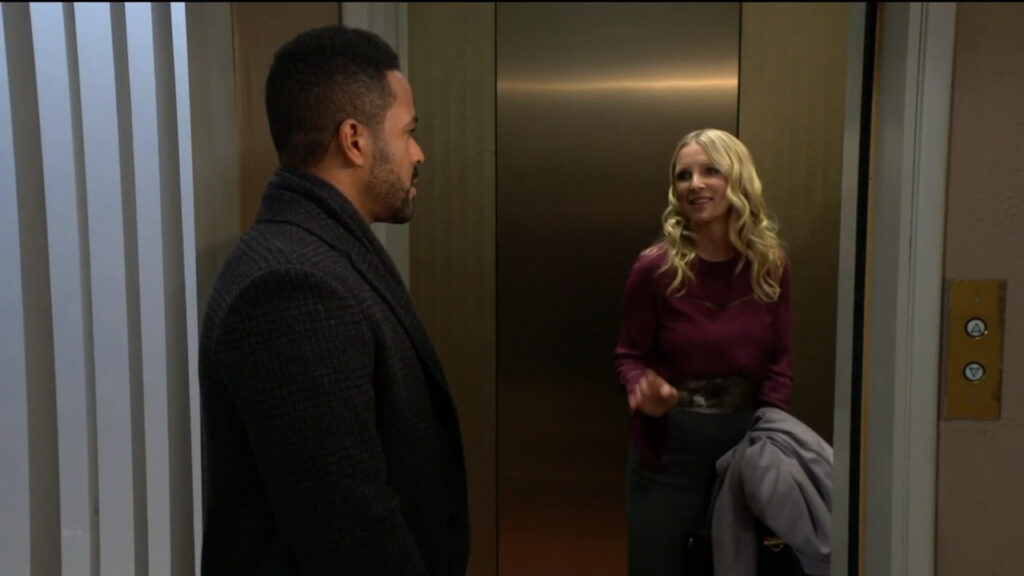 Christine smiles at Nate as she gets in the elevator
