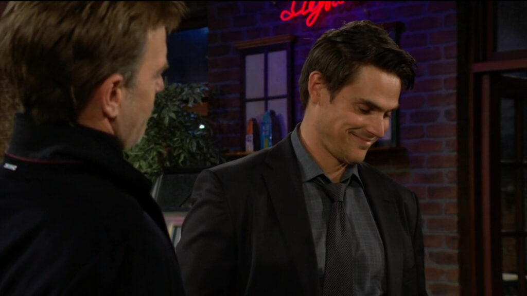 Adam smiles as he talks with Tucker in the coffee shop
