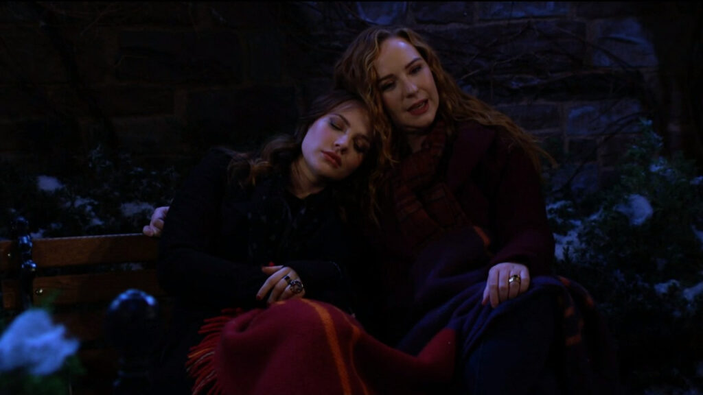 Tessa rests her head on Mariah's shoulder as they talk in the park