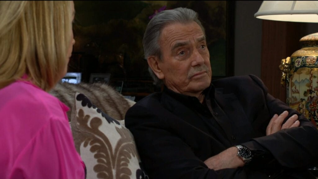 Victor Newman and Nikki talk on the sofa