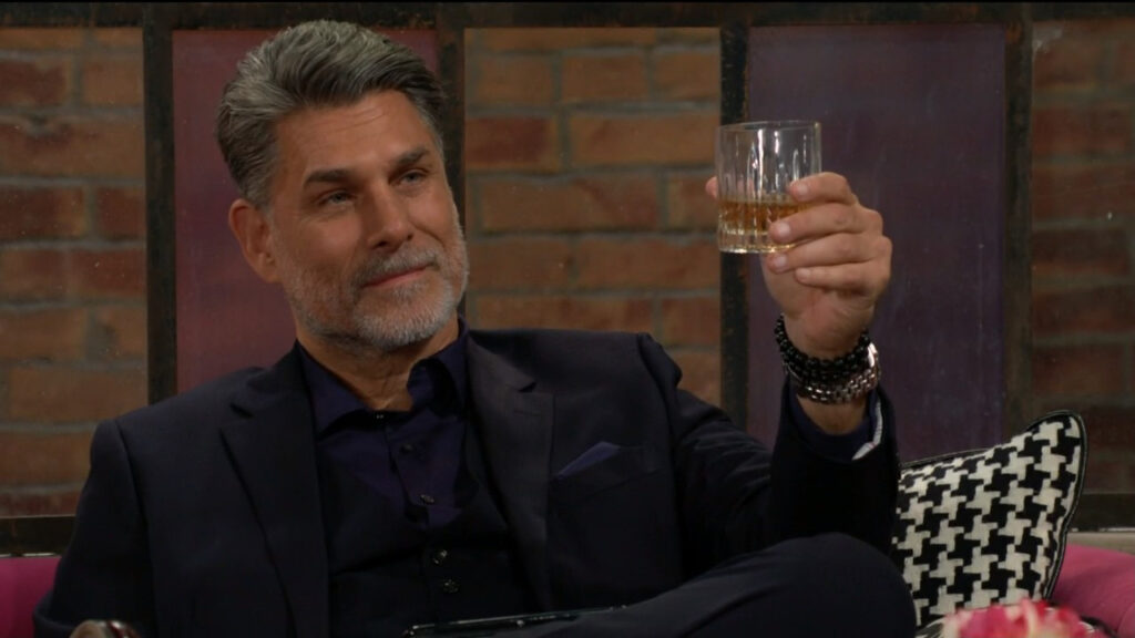 Jeremy Stark raises his glass in a toast to Phyllis.
