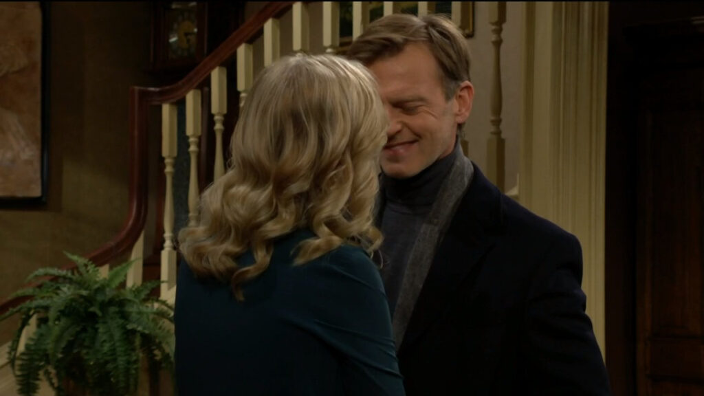 Tucker smiles as he goes to kiss Ashley but stops himself