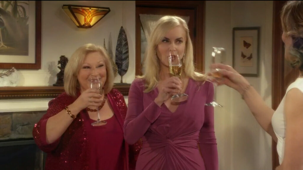 Traci, Ashley, and Diane toast each other with champagne