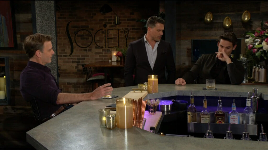 Nick talks with Adam and Tucker at the bar in Society