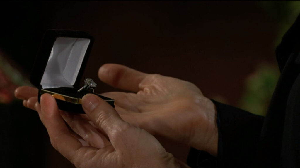Phyllis looks at Diane's ring