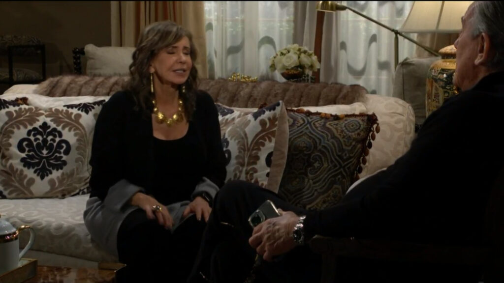 Jill and Victor talk as they have a seat in the Newman living room