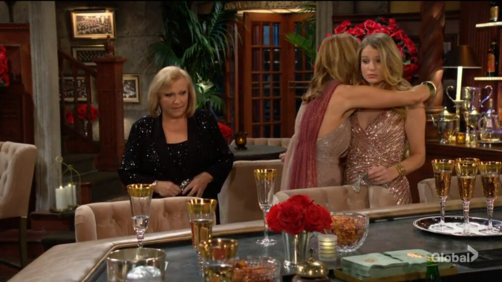 Phyllis hugs Summer as Traci looks on uncomfortably