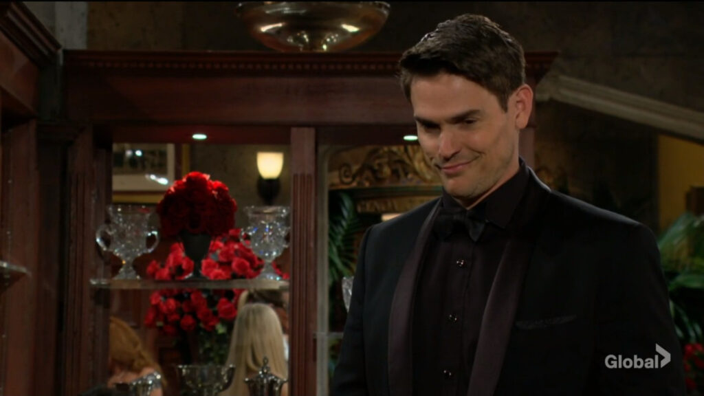 Adam smirks as he talks with Victor and Victoria