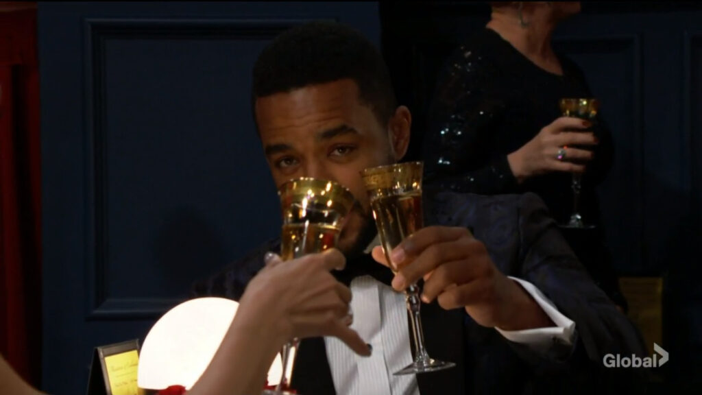 Nate and Elena toast to each other