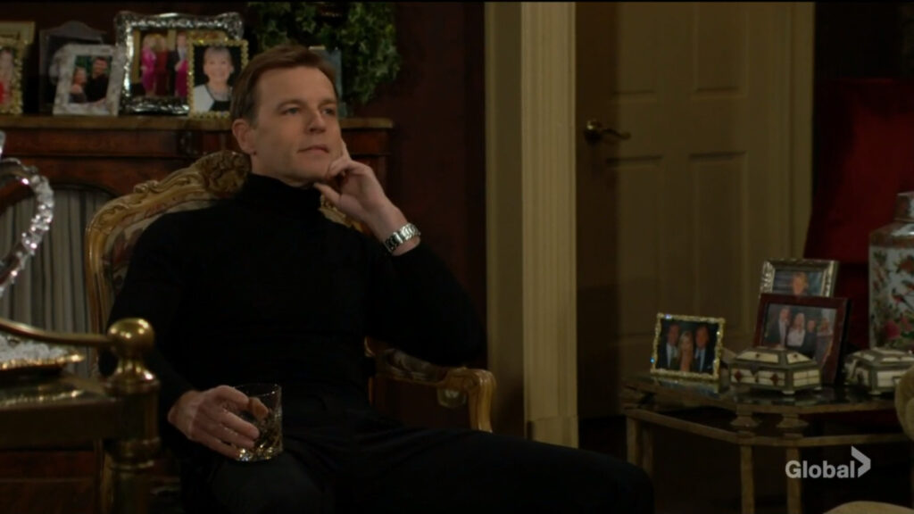 Tucker sits with a glass of whiskey in his hand as he listens to Ashley