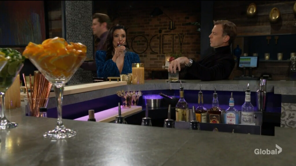 Audra and Tucker sit at the bar drinking and talking