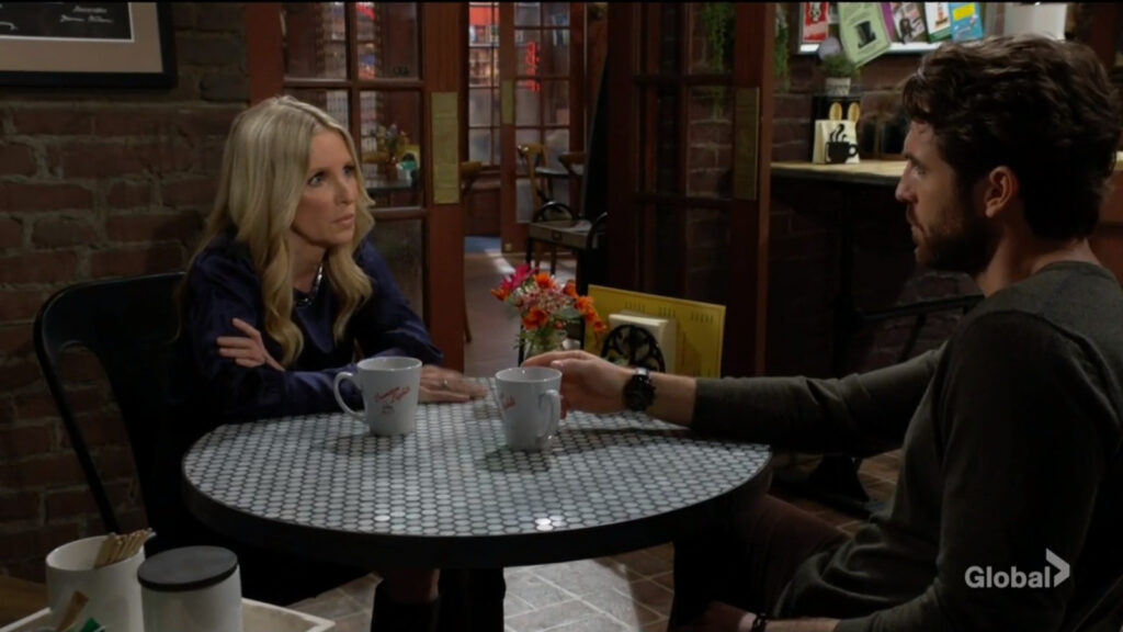 Christine and Chance talk as they sit in the cafe