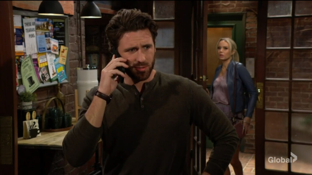 Chance is on the phone as Abby walks in the door behind him