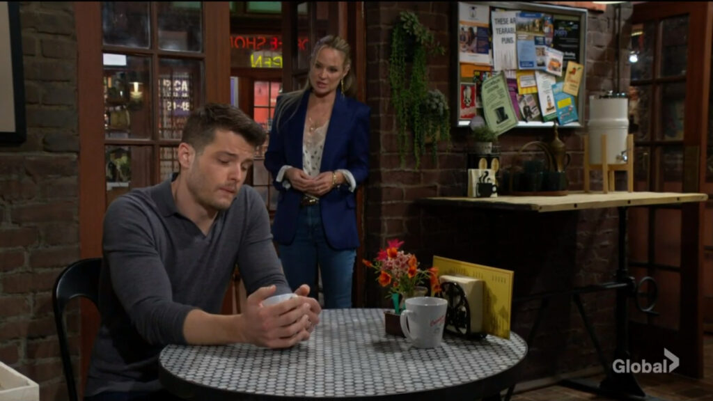 Sharon walks over to speak with Kyle as he sits alone in the coffee shop