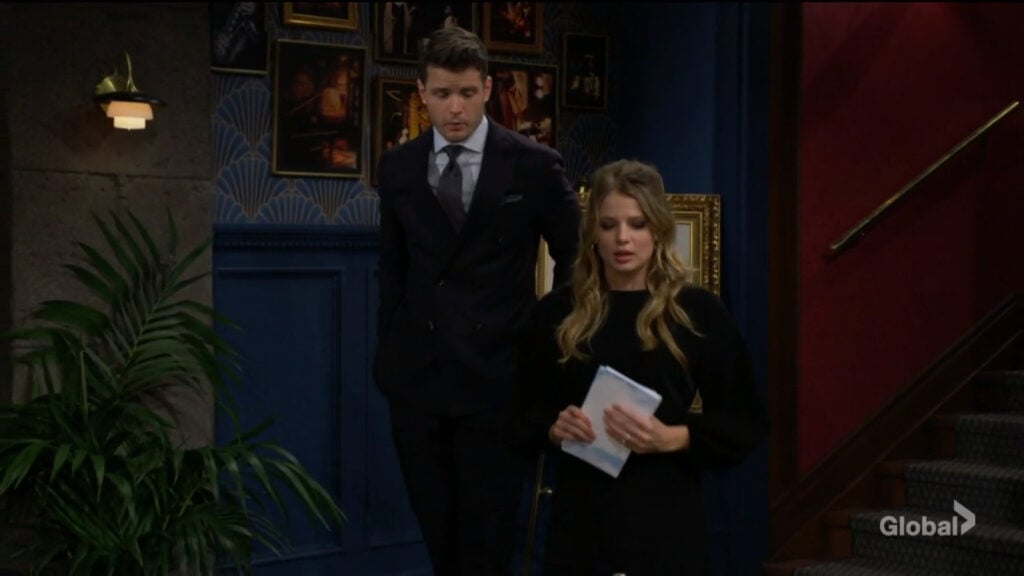 Kyle and Summer talk in front of Phyllis's portrait