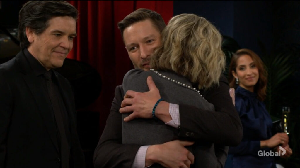 Daniel hugs Lucy as Danny and Lily look on
