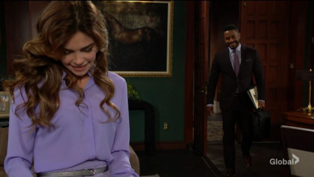 Nate and Victoria smile as Nate walks into Victoria's office