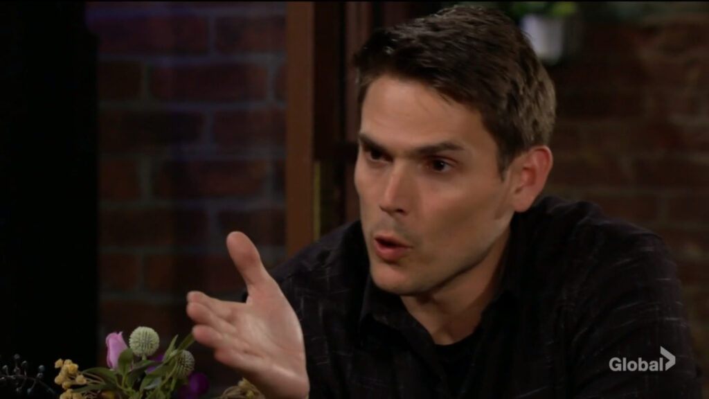 Adam gestures as he talks with Victor