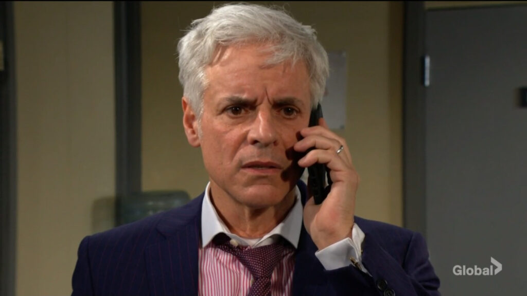 Michael looks concerned as he speaks on the phone.