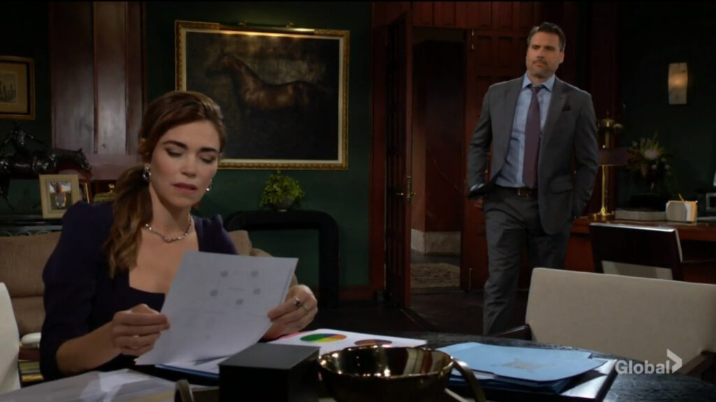 Nick talks with Victoria as she works on paperwork.
