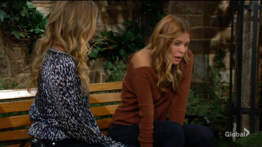 Phyllis sits beside Summer as they talk in the park.