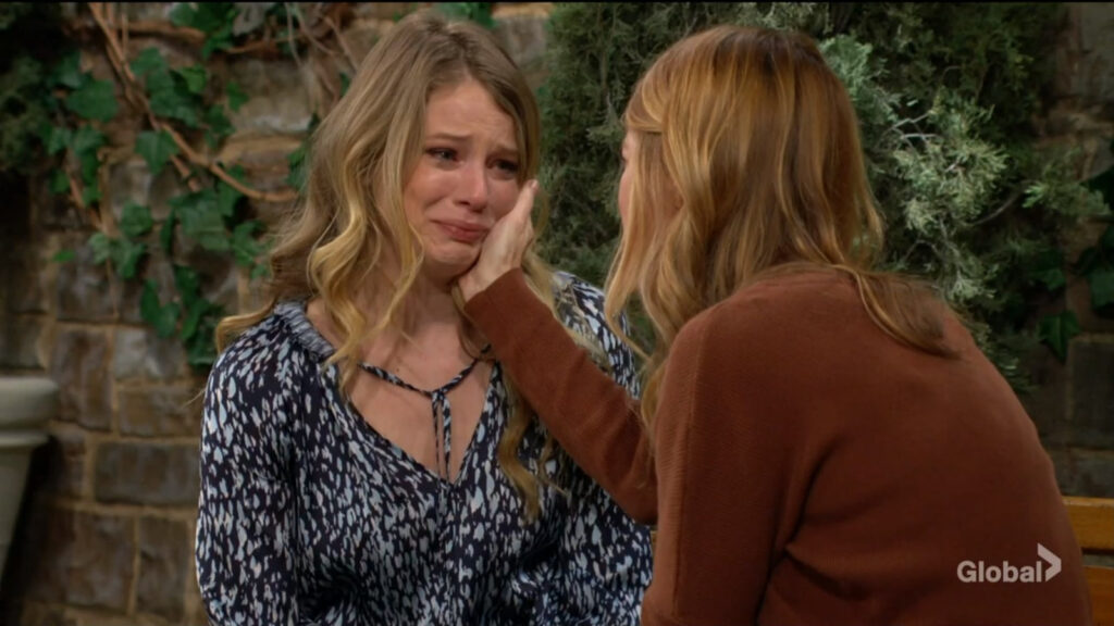 Phyllis strokes Summer's crying face as she talks with her.
