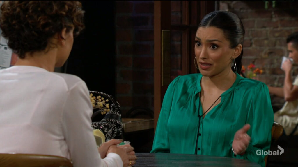 Audra talks with Elena.