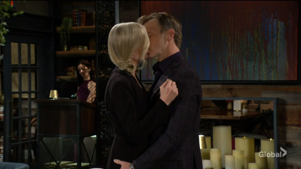 Tucker and Ashley stand up and kiss each other in the middle of the restaurant.