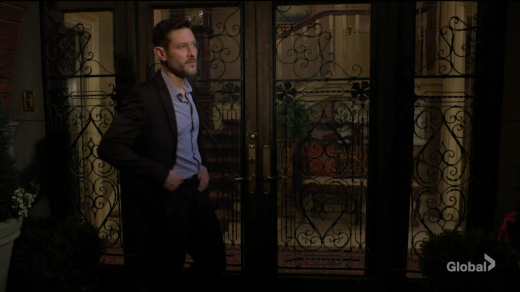 Daniel stands outside the Abbott mansion's front door.