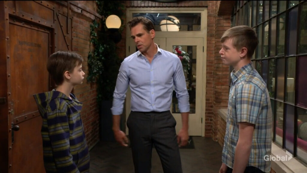 Connor, Billy, and Johnny stand outside Society and talk.