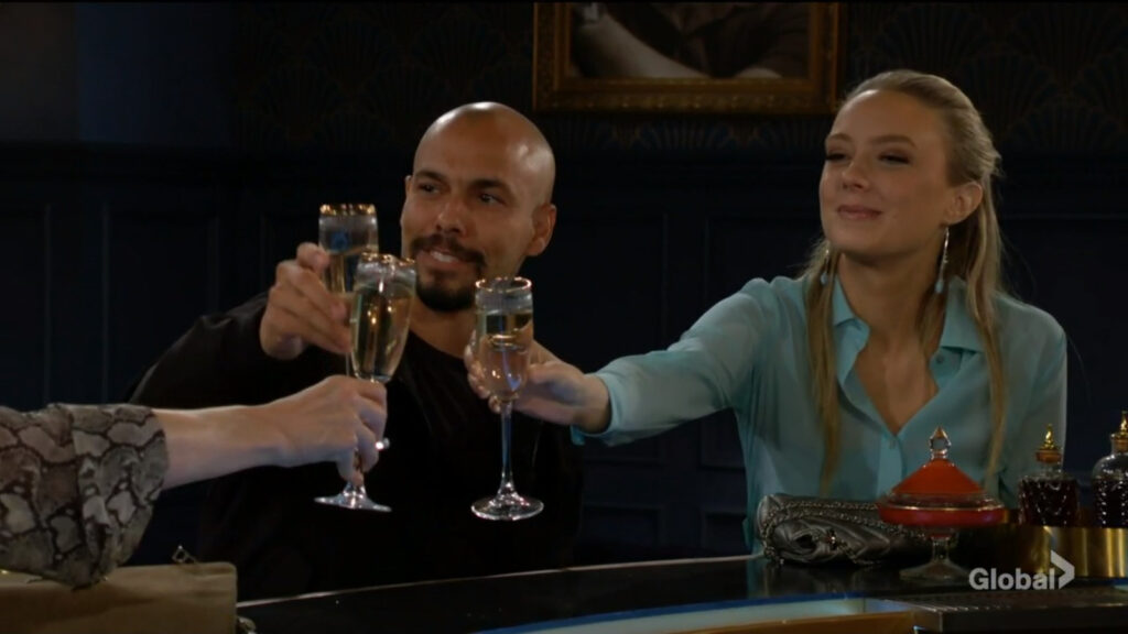 Devon and Abby raise their glasses to honor Neil.
