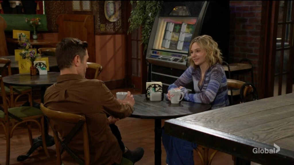 Lucy sits and talks with Daniel.